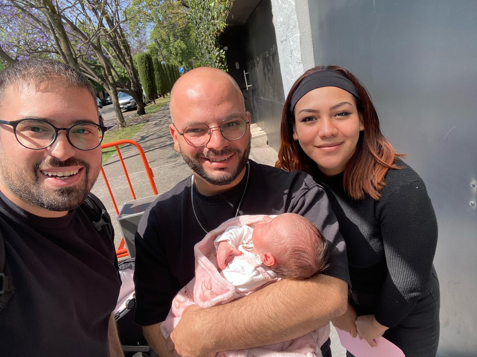 Intended parents with their surrogate during the pregnancy